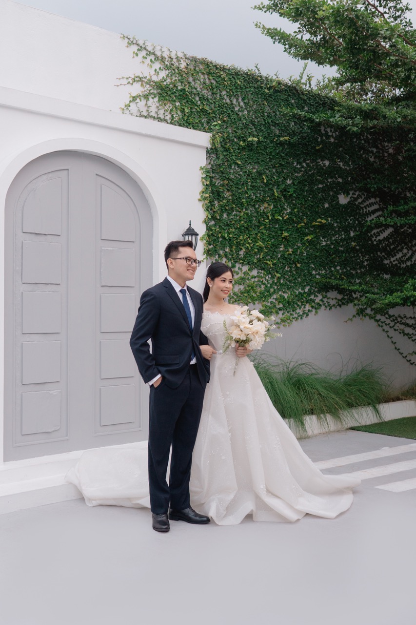 Yesa and Ester walking through an olive grove at golden hour